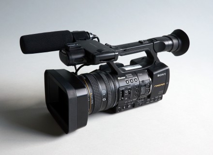 Photograph of a Sony NX5U video camera on a grey gradient background.