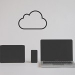 Picture of computers with a cloud icon above