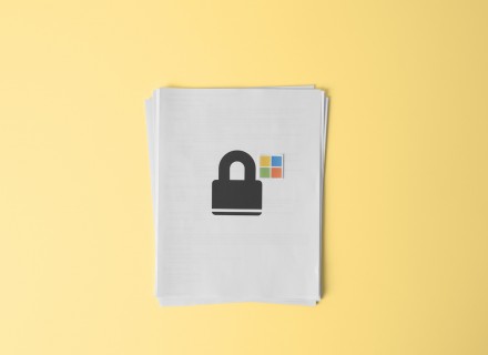 Photo of white printer paper with an image of a lock and windows icon on the page.